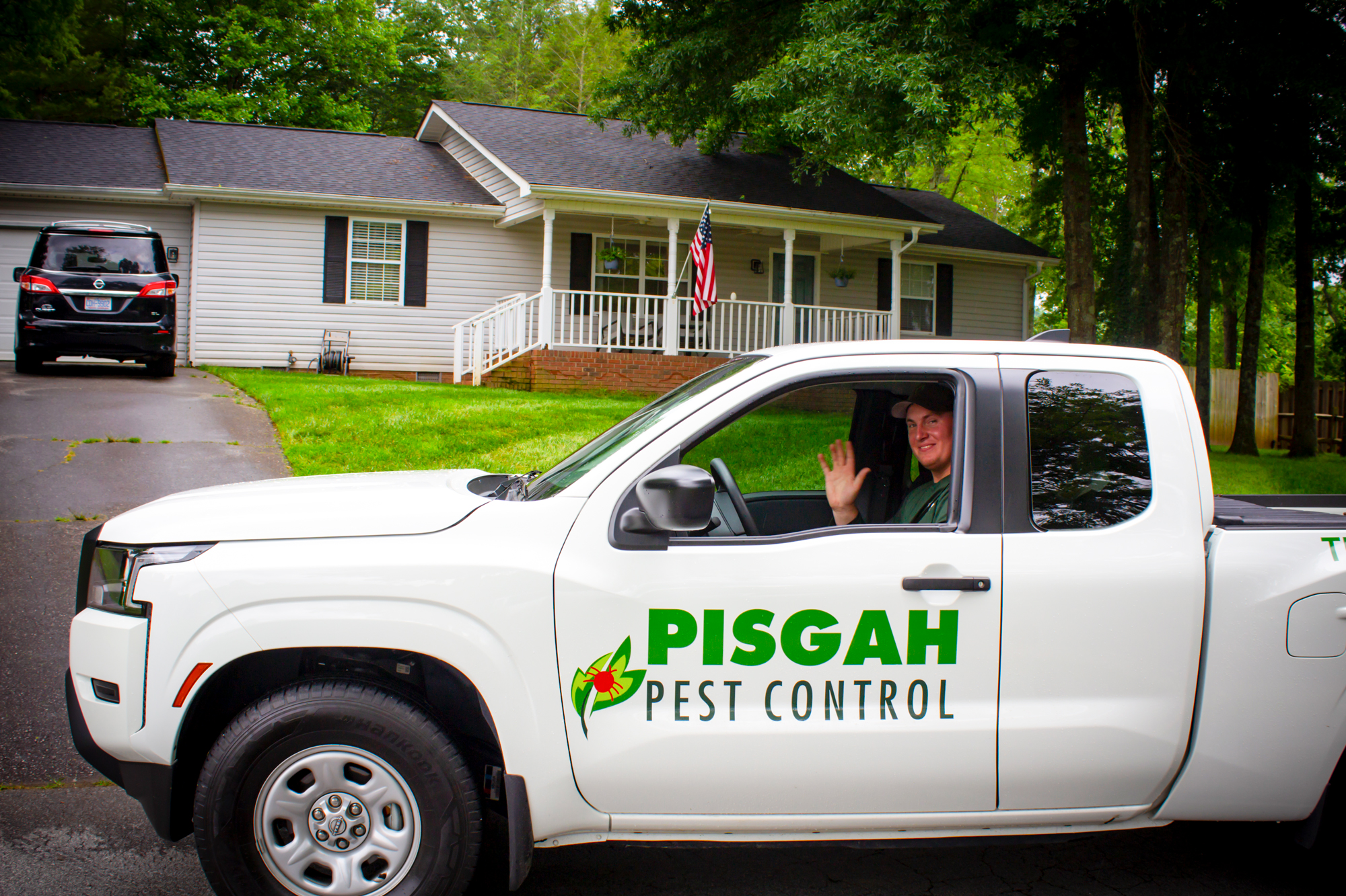 pest control technician waving from truck
